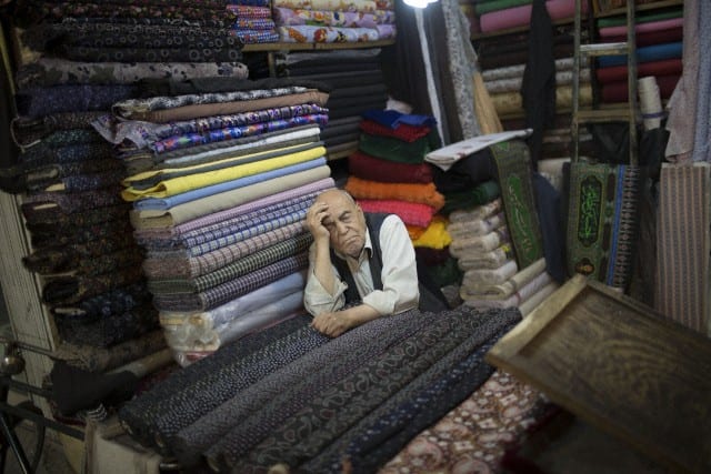 Isfahan, Iran An Iranian Trader Sleeps As He Sit At His Cloth Shop In Isfahan Traditional Grand Bazaar, Km ( Miles) South Of Tehran. Traditional Grand Bazaar Is A Historical Market In The City Of Isfahan Also Is One Of The Oldest And Largest Bazaars In The Middle East Which Is Dating Back To The Th Century. The Bazaar With Km Length Is The Main Connection Between The Old City With The New. Morteza Nikoubazl/Zumapress Isfahan, Iran An Iranian Trader Sleeps As He Sit At His Cloth Shop In Isfahan Traditional Grand Bazaar, Km ( Miles) South Of Tehran. Traditional Grand Bazaar Is A Historical Market In The City Of Isfahan Also Is One Of The Oldest And Largest Bazaars In The Middle East Which Is Dating Back To The Th Century. The Bazaar With Km Length Is The Main Connection Between The Old City With The New. Morteza Nikoubazl/Zumapress