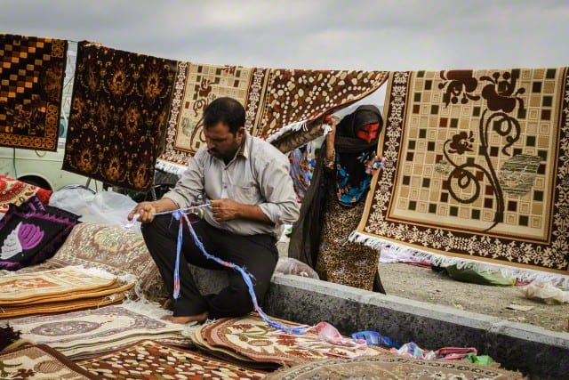 Bandari Woman And Carpet Seller In The Weekly 'Panjshambe Bazar', Minab, Iran.