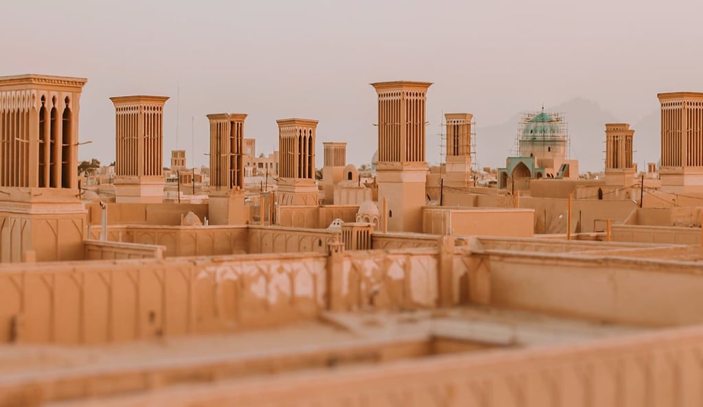 Yazd Old City: A Labyrinth Of History. Winding Lanes, Sun Baked Mud Brick Buildings, And Iconic Wind Catchers Define This Ancient Desert City. Yazd Old City: A Labyrinth Of History. Winding Lanes, Sun Baked Mud Brick Buildings, And Iconic Wind Catchers Define This Ancient Desert City.