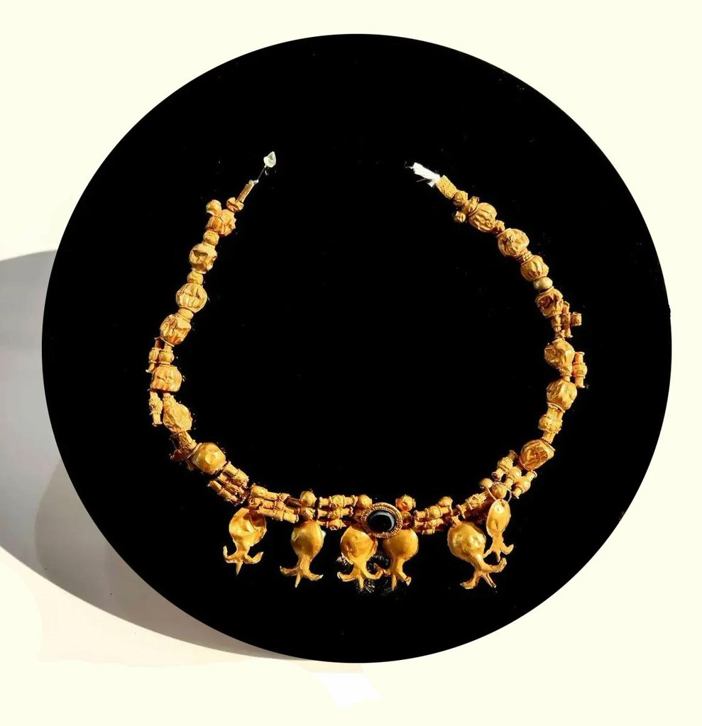The Pomegranate In Iran: A Symbol Of Life, Faith, And Art 7 Gold Necklace With Pomegranate-Shaped Pendants, Early 1St Millennium Bce, Marlik, Gilan, National Museum Of Iran This Gold Necklace, Featuring Beads In Various Shapes And Pomegranate-Shaped Pendants, Reflects The Early Use Of Pomegranate Motifs As Symbols Of Fertility In Pre-Islamic Women&Amp;Apos;S Jewelry. Discovered In Marlik, Gilan, It Exemplifies The Artistic And Cultural Significance Of Pomegranate Imagery In Ancient Iran.
