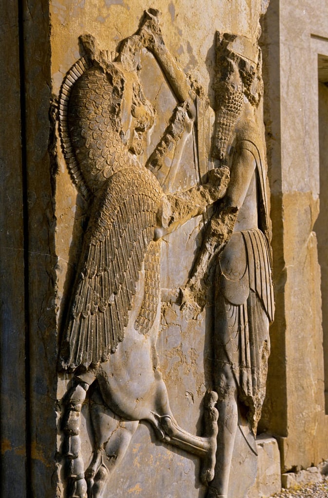 Iranian Mythology: A Rich Collection Of Gods, Heroes, And Epic Tales 9 This Ancient Bas-Relief From Persepolis, The Ceremonial Capital Of The Achaemenid Empire, Depicts A Warrior In Combat With A Lion. Likely Symbolizing Royal Power, Strength, And Cosmic Balance, Such Imagery Was Common In Persian Art, Reflecting The Empire’s Authority And Dominance Over Chaos.