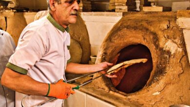 A Skilled Baker Prepares Fresh Bread In His Workshop At Yazd Bazaar, Located In The Historic City Of Yazd, Iran.