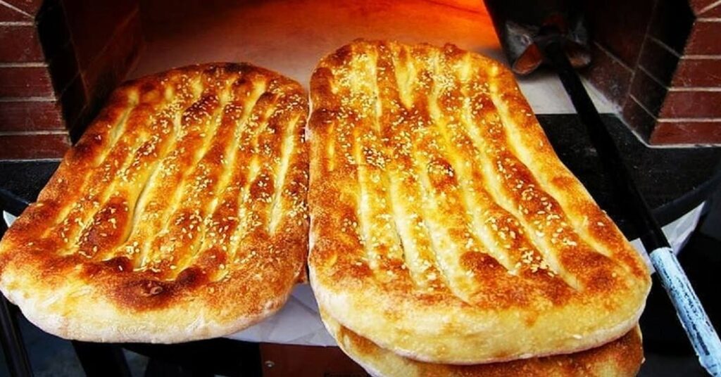 18 Popular Types Of Iranian Bread You Must Try 4 Thick And Fluffy Barbari Bread With A Crispy Crust, A Popular Choice In Iran, Especially For Breakfast With Cheese, Herbs, And Tea.