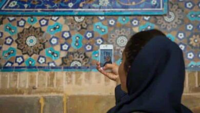 Your Guide To Mobile Sim Cards In Iran 5 Iran, Isfahan Province, Isfahan, Iranian Tourist Taking Picture With Her Mobile Phone