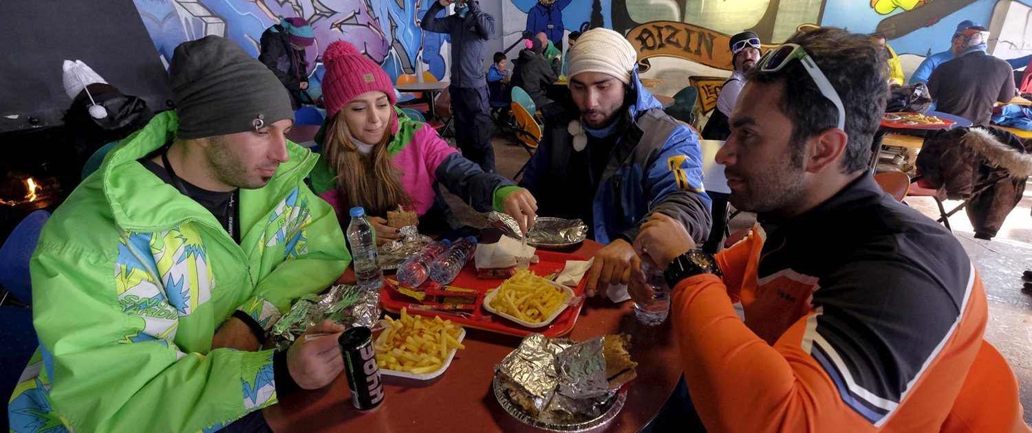 Young people skiing at the Dizin ski resort