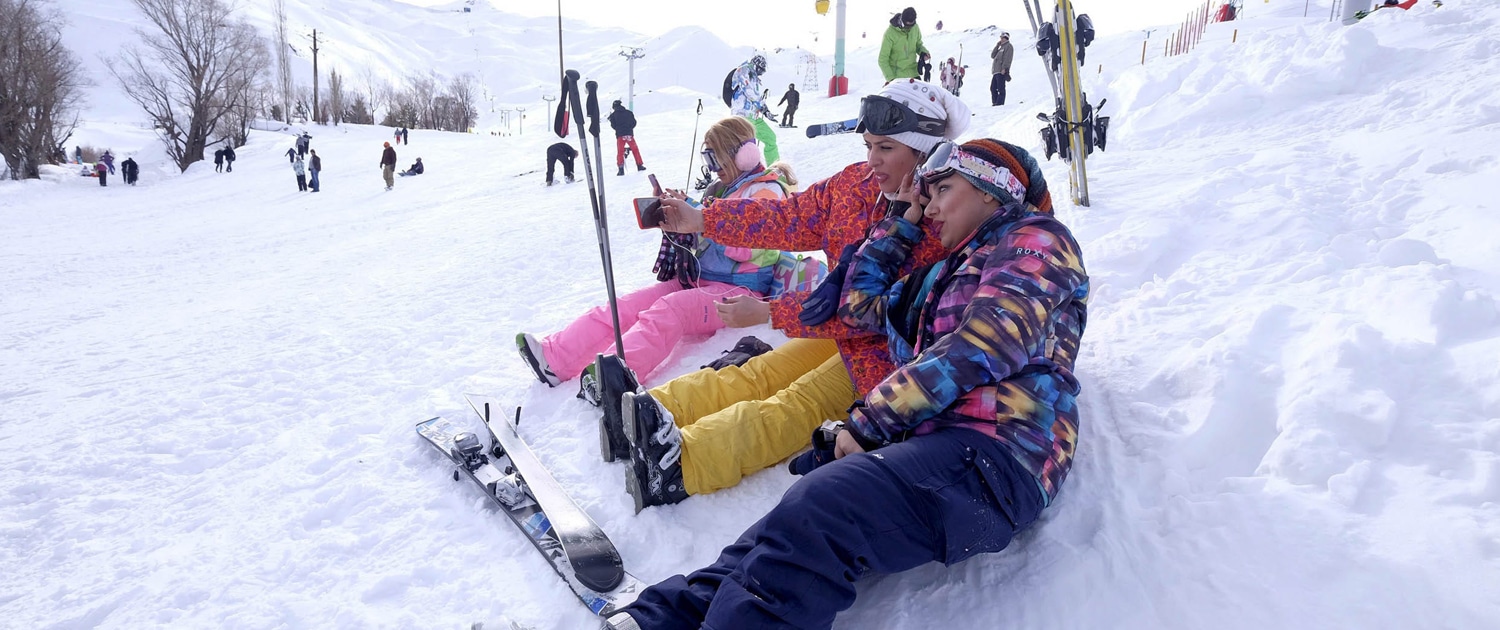 Young people skiing at the Dizin ski resort