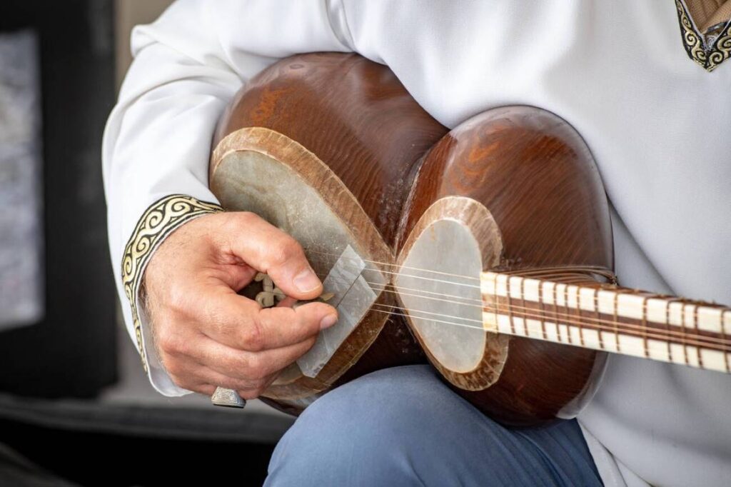 Persian Tar A Mans Hand Strums A Tar