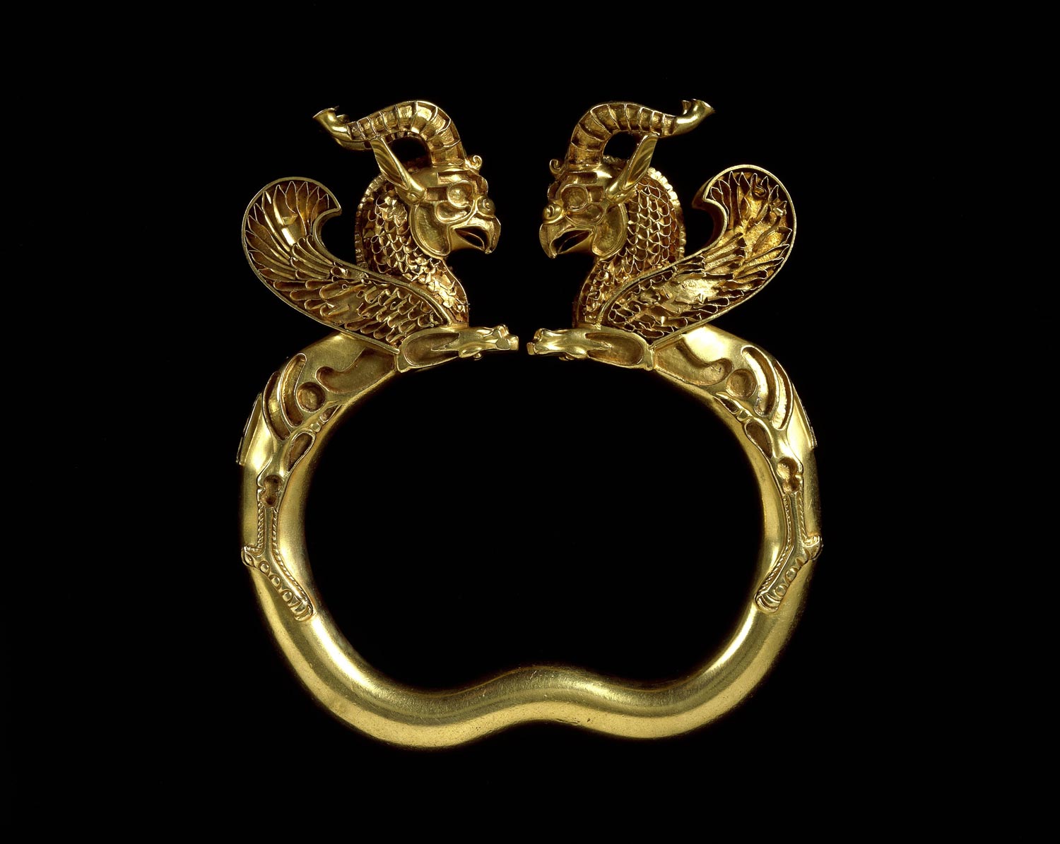 The Achaemenid Empire: Foundations Of Imperial Governance 14 Gold Griffin-Headed Armlet, 500–330 B.c. This Gold Armlet, Part Of The Oxus Treasure, Features Terminals Shaped As Winged Griffins. Originally Adorned With Turquoise, Lapis Lazuli, Carnelian, And Colored Glass, It Exemplifies Achaemenid Craftsmanship. Such Armlets Were Prestigious Gifts At The Persian Court And Are Depicted In The Apadana Reliefs At Persepolis. This Piece, Found In Present-Day Tajikistan, Was Acquired By Captain Burton And Sold To The Victoria And Albert Museum In 1880 For £1,000. Its Pair Resides In The British Museum.
