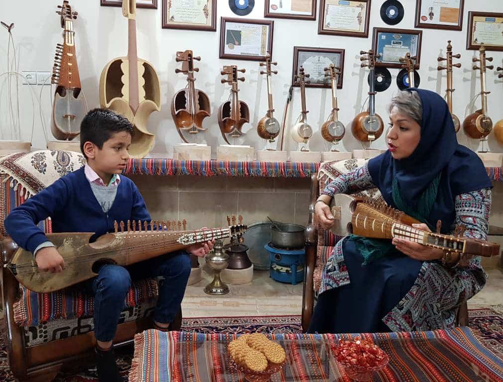 The Art Of Crafting And Playing Rubab Recognized As Unesco Heritage 2 A Female Rubab Master Teaches Her Young Student The Intricate Art Of Fretting And Plucking, Preserving The Timeless Craft Of Traditional Music. Photo By Shahab Nikman, Iran, 2020