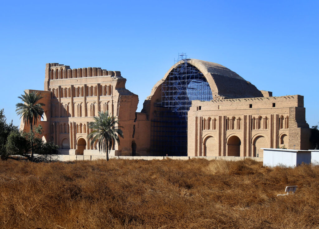 Marvel At The Towering Brick Vault Of The Arch Of Ctesiphon, A Monumental Testament To The Sasanian Empire’s Grandeur Under Chosroes I In The 6Th Century Ce, Standing Resolute In Iraq’s Ancient Heartland, Where Echoes Of A Mighty Civilization Still Resonate Across Time.